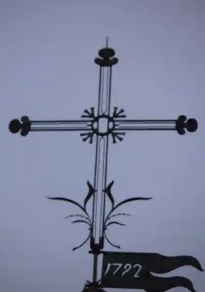 Steeple cross on top of Church of St. Ambrose